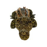 Large, soft green and brown mottled crocodile plush toy with friendly yellow eyes and orange back spines.