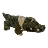 32cm dark green plush crocodile soft toy with textured skin, white teeth, and a cream mid-section strap.