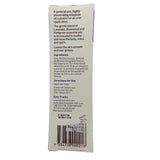 Back label of a massage oil container with text and a barcode on a white background