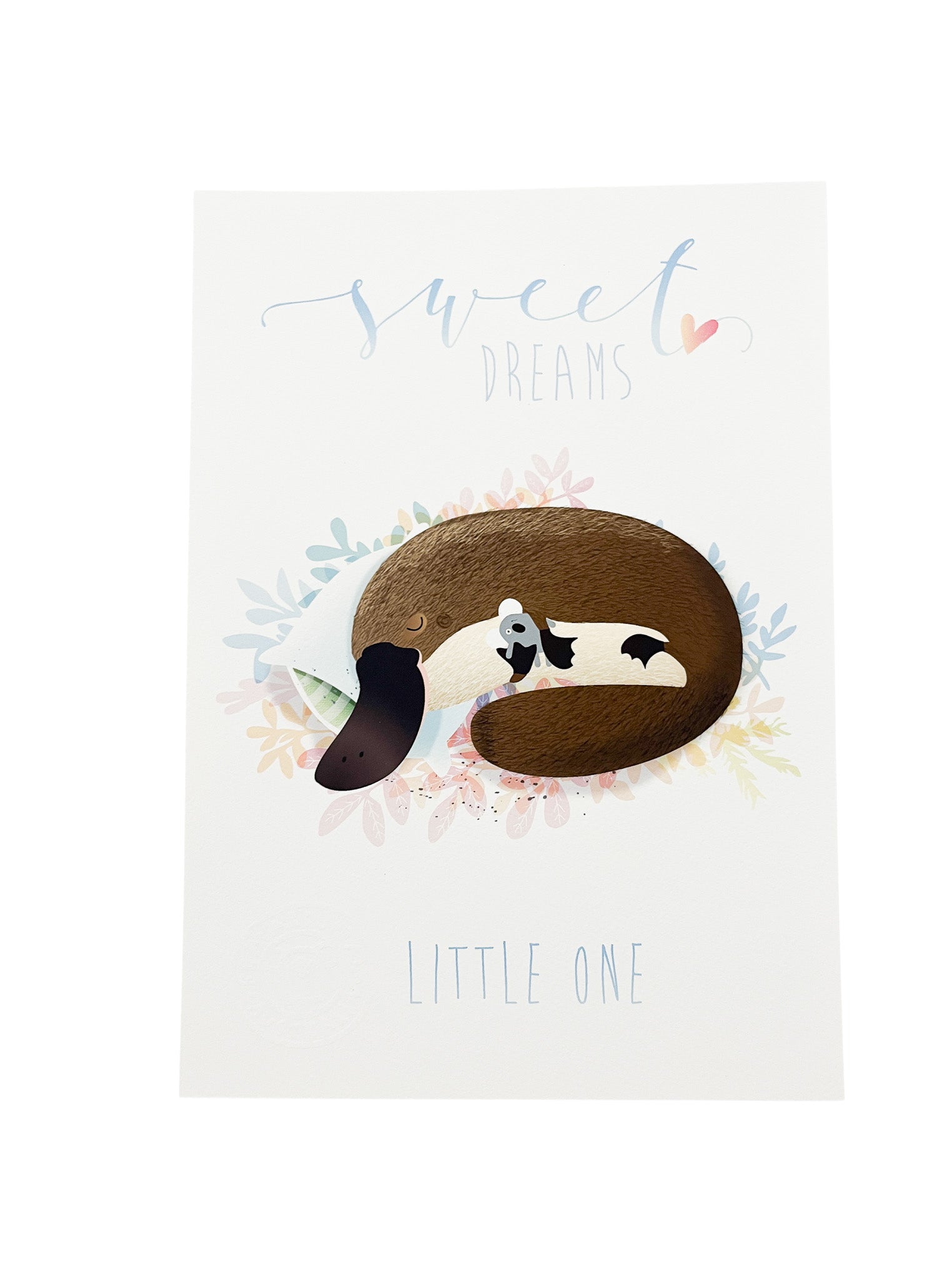 A4 Sweet Dreams Little One text with a platypus and puggle sleeping on a pillow illustration on a white background. 