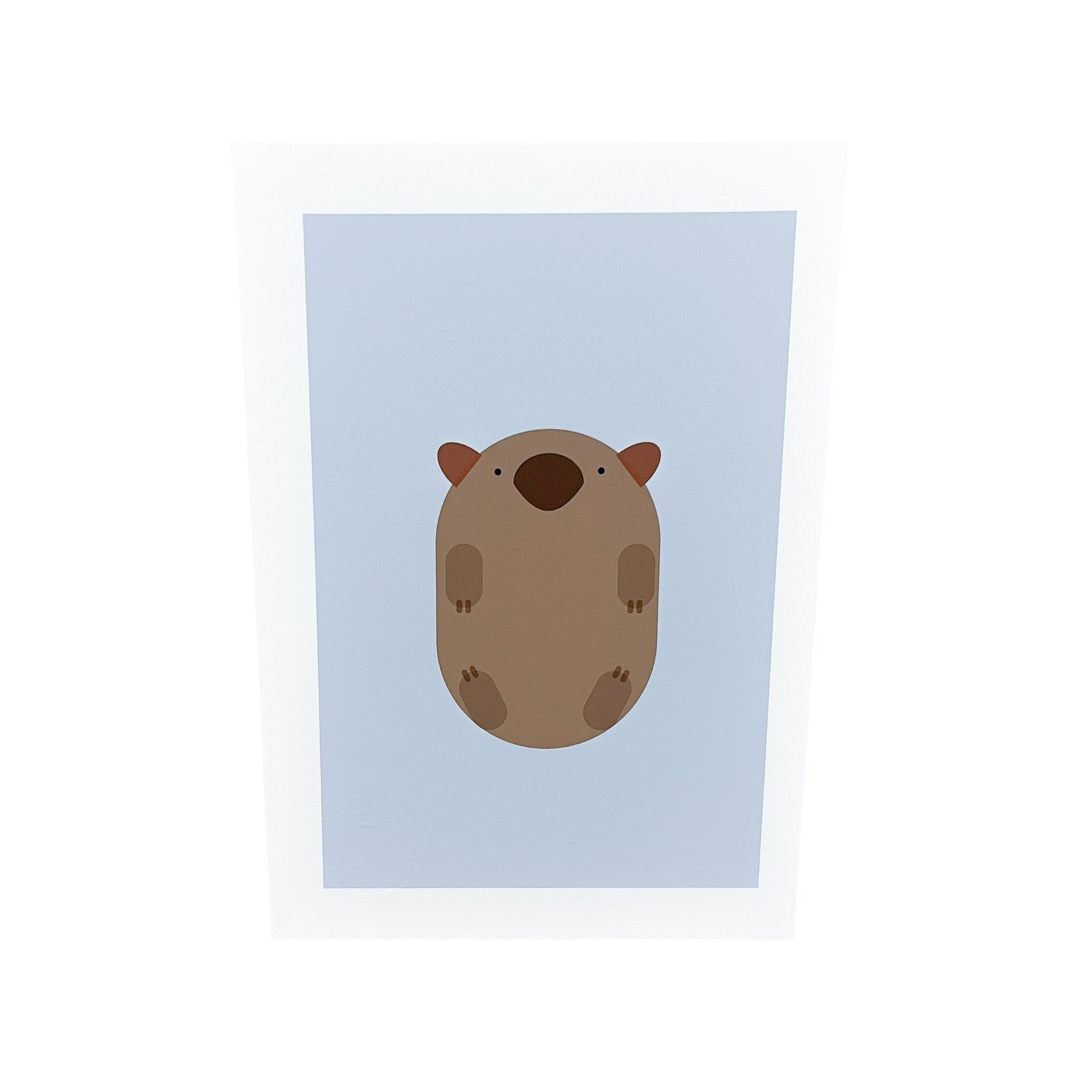 Minimalist A4 art print featuring a brown geometric wombat on a soft blue background with a white border.