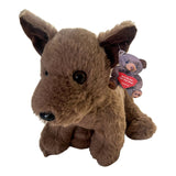 A cuddly brown Kelpie plush dog toy, approx. 25cm, with soft fur, pointed ears, and a small teddy bear tag.