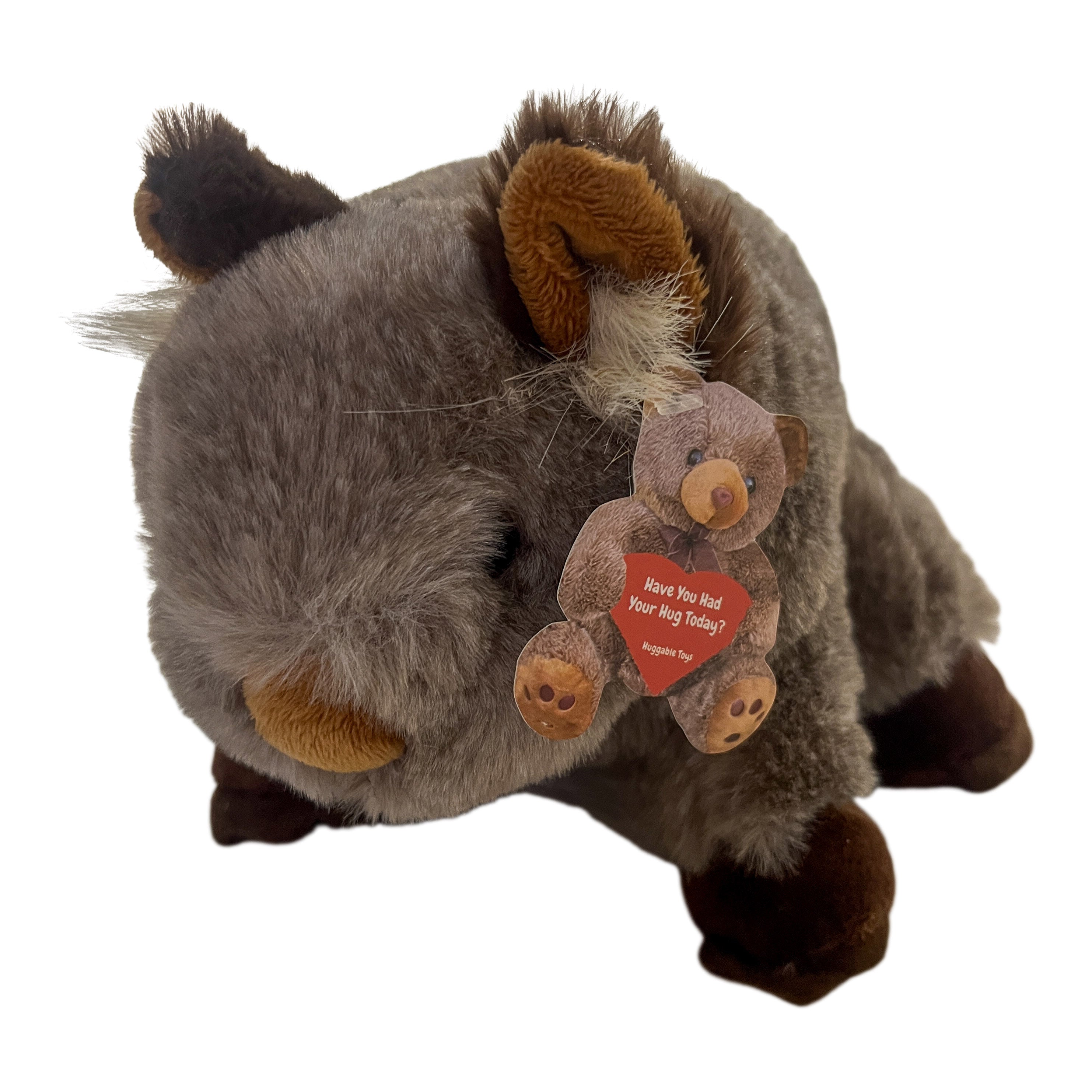 Cuddly gray-brown Walter the Wombat soft plush toy, with dark brown ears, nose, feet, and a small teddy bear charm.