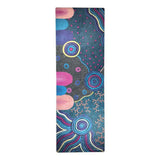 Oorunye washable yoga mat with Hayley Pearson's Aboriginal art, featuring colorful concentric circles, wavy lines, and dots on a dark blue background.
