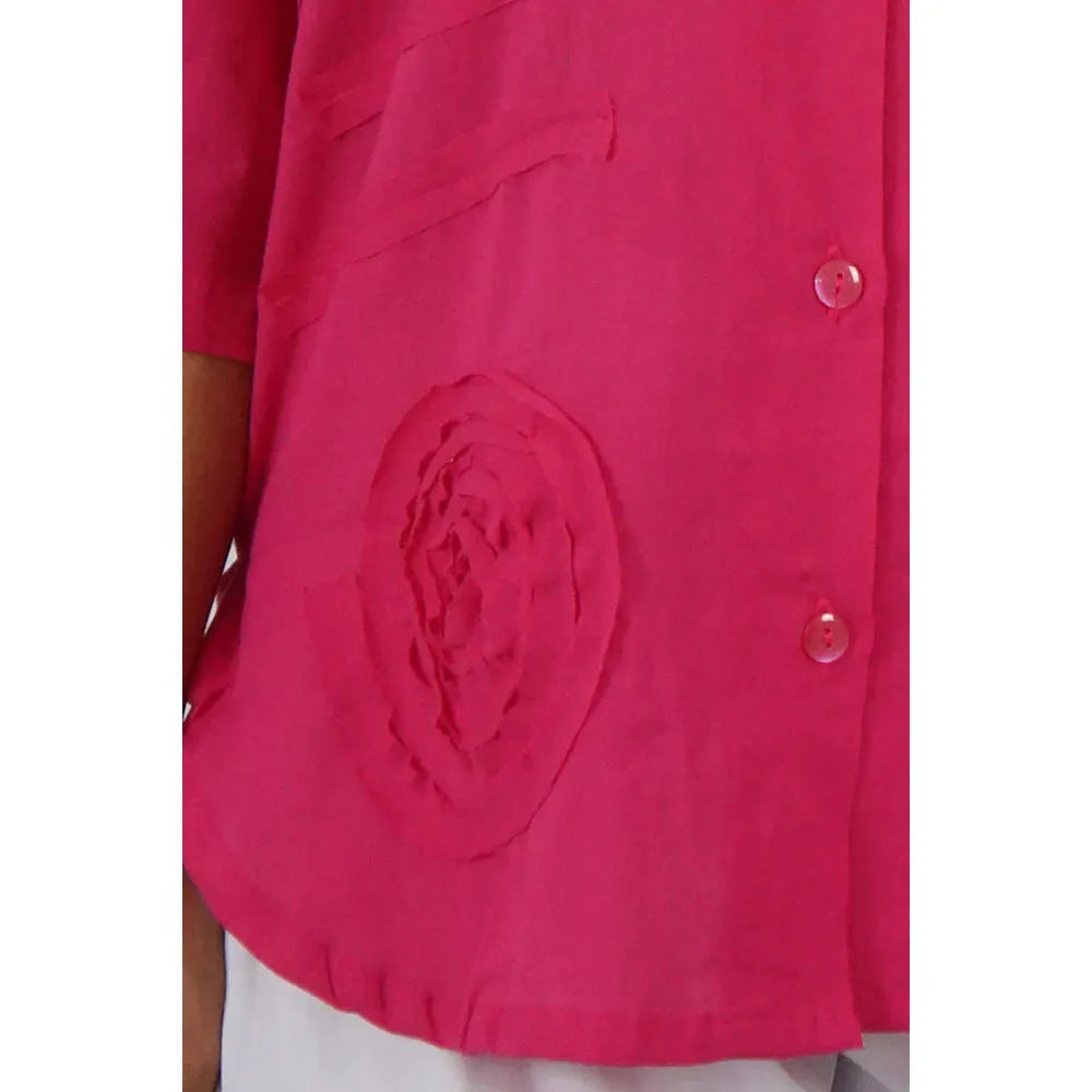 Women Wearing Pink Lilly Button Down Shirt - Close Up Of Bottom Left Hand Spiral