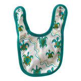 Soft white cotton baby bib with teal trim, featuring Aboriginal Yalnga green turtle design and 3 snap closures.